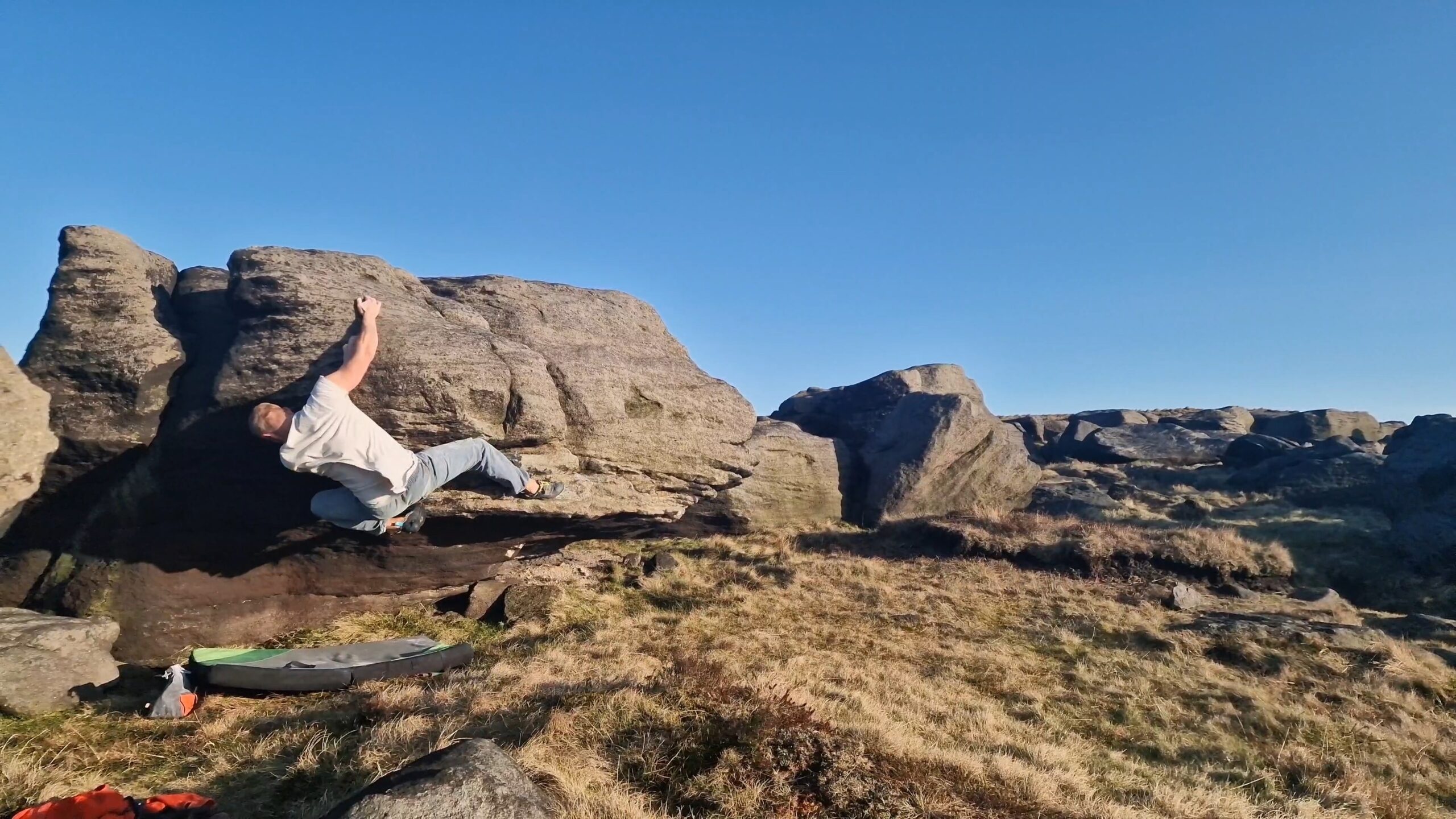 A picture of me climbing Deft Cleft (easy variant) at Blackstone Edge